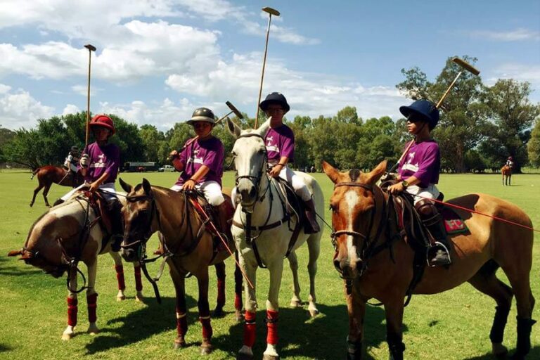 Young Polo Players on horses